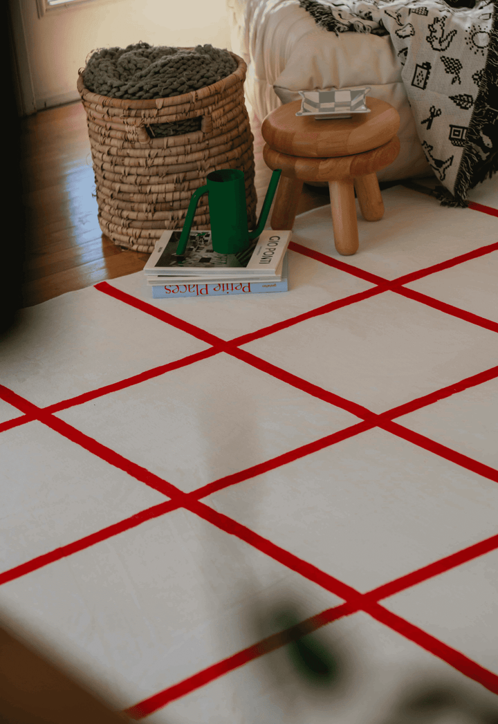 A cozy spot with the LanySpace Red and White Grid Modern Rug