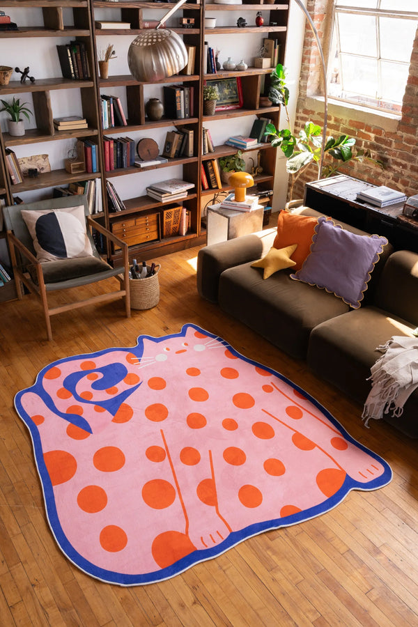 Polka dots Funky Cat Rug by Becca Franks displayed in a cozy loft living room with wood floors and eclectic decor