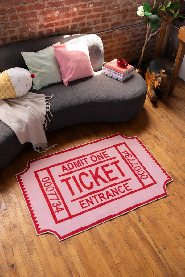 Red Ticket Abstract Rug by Elizabeth Bay in cozy living room with gray sofa and wood floor