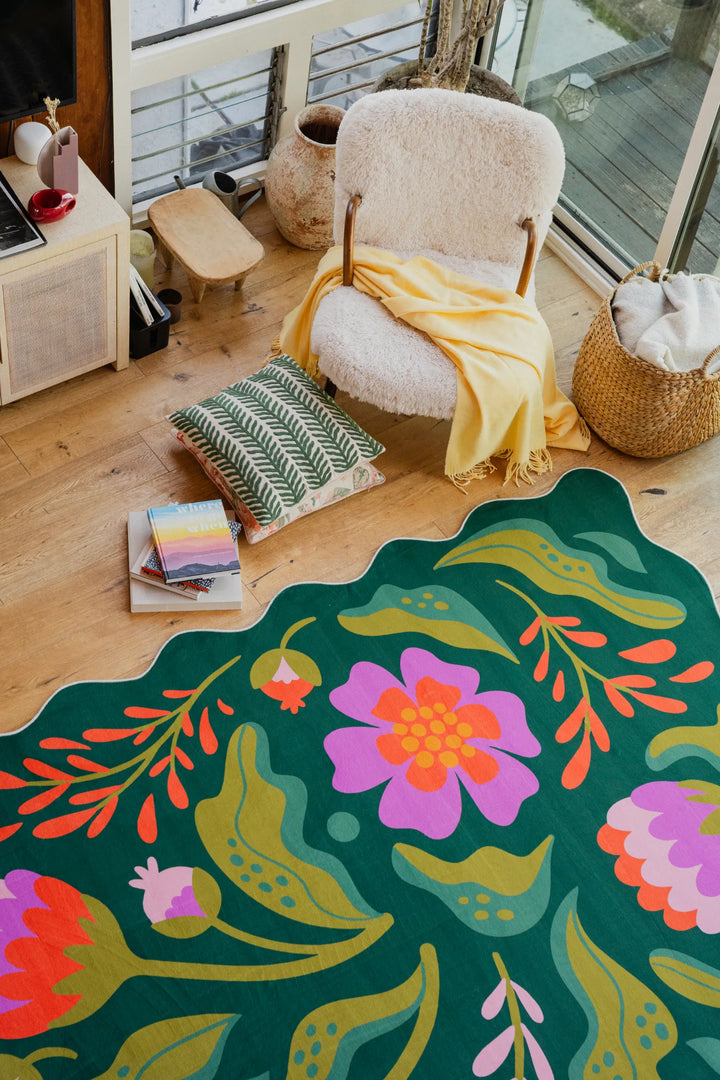 The green rug with pink and purple floral details from the latest Lany Space Designer Collection adds a fresh touch to the living room