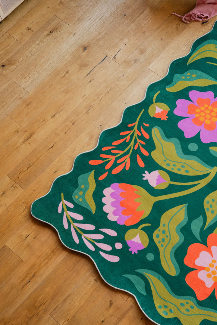 Details of the green rug with pink and purple floral accents from the latest Lany Space Designer Collection