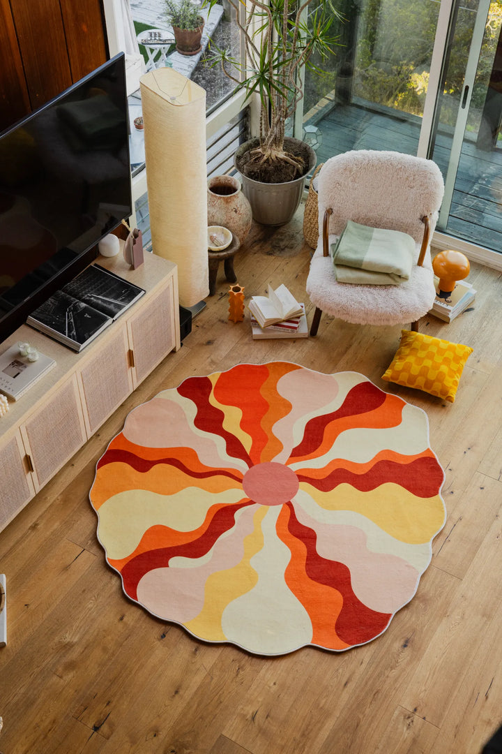 Lany Space x Maggie Stephenson Unique Shaped Sundial Orange Rug in the living room