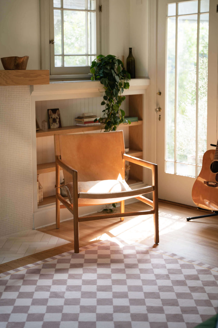 the corner of the living room with Beige and Cream Diamond Area Rug