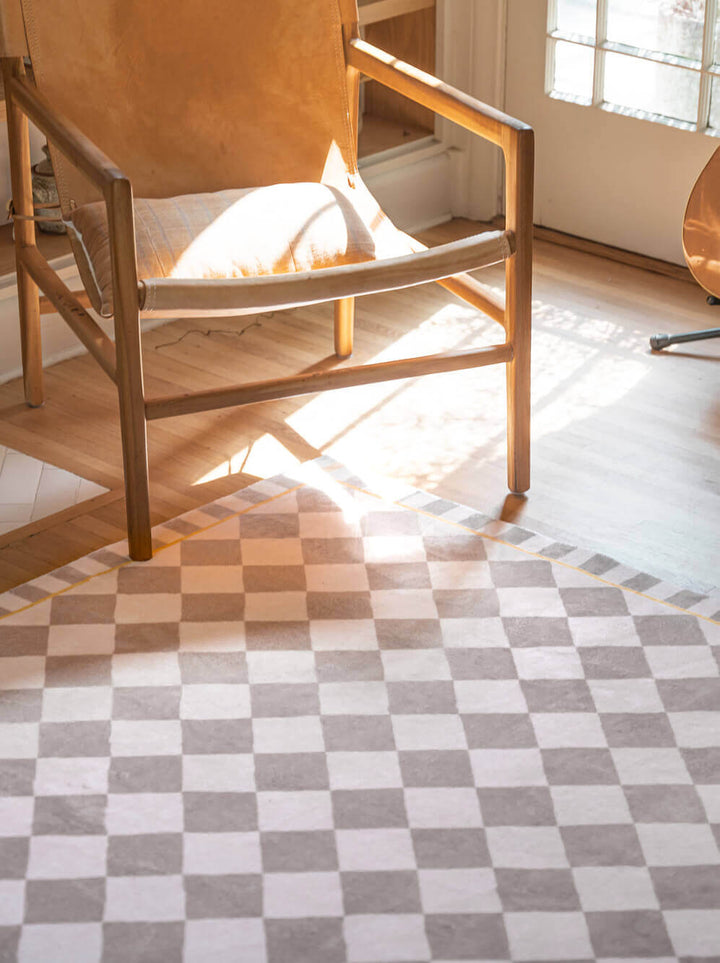 a retro chair on the Beige and Cream Diamond Area Rug