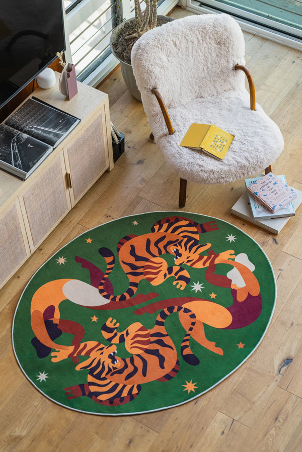 Oval Wild Stars Green Rug by Maggie Stephenson centered in a bright living room, styled with soft furnish and wood floor.