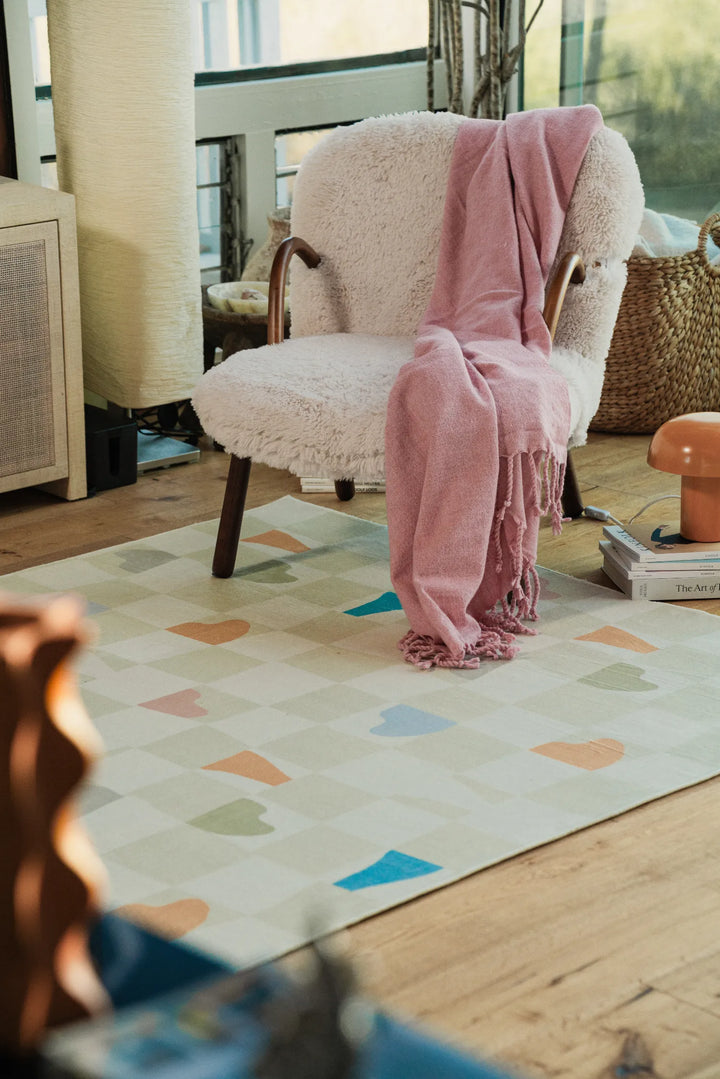 Cozy nook featuring the Jonnie Li Modern Mosaic Neutral Pastel Rug (5' x 7') in the living room