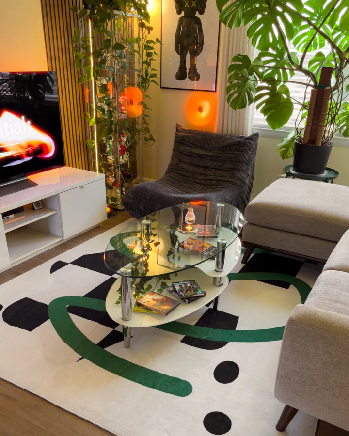 Black and White Checkered Rug placed under a glass table on wood floor, with nearby seating and plants enhancing the cozy setting.
